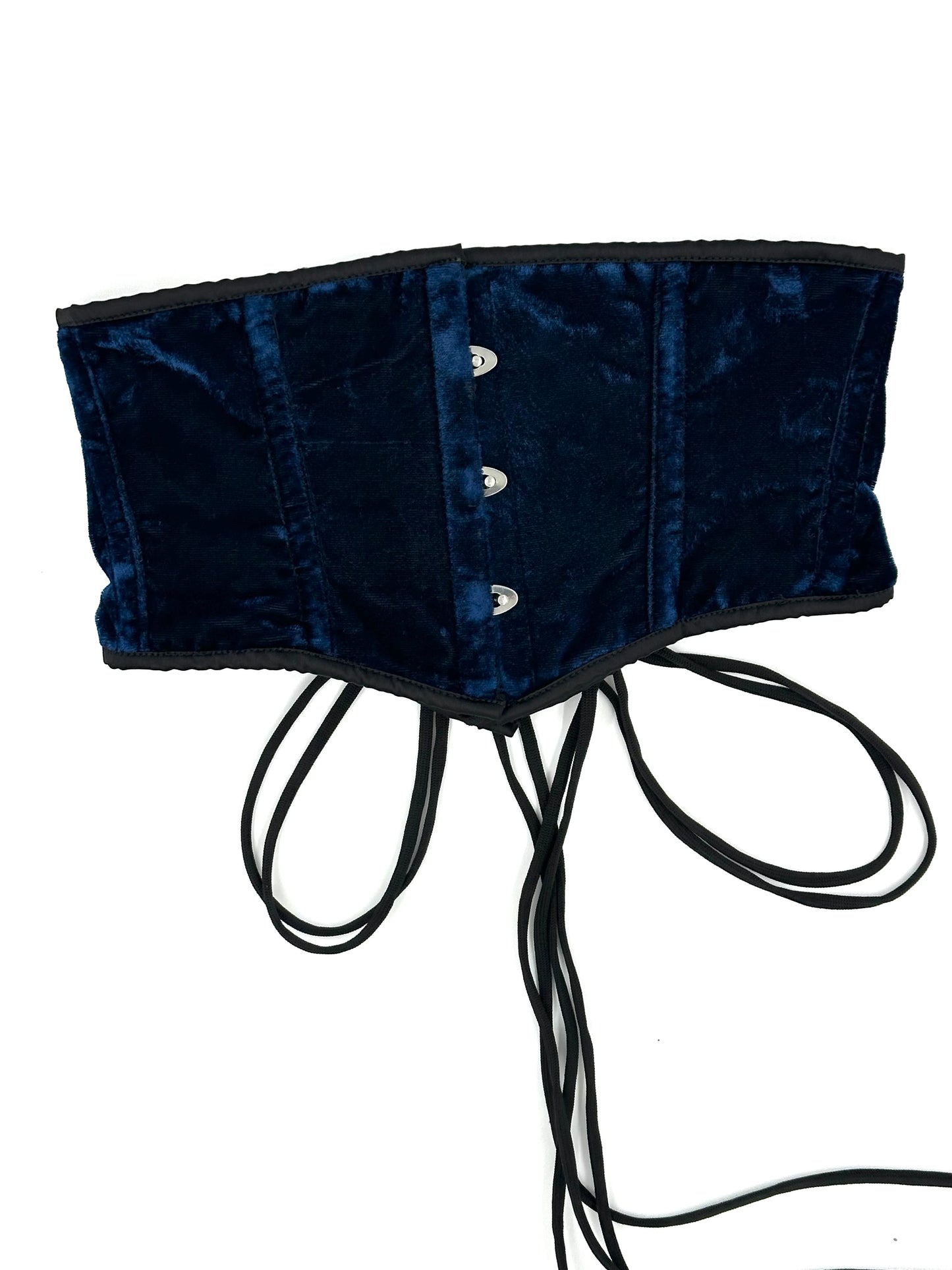 Navy blue velvet corset with buttons on a white background