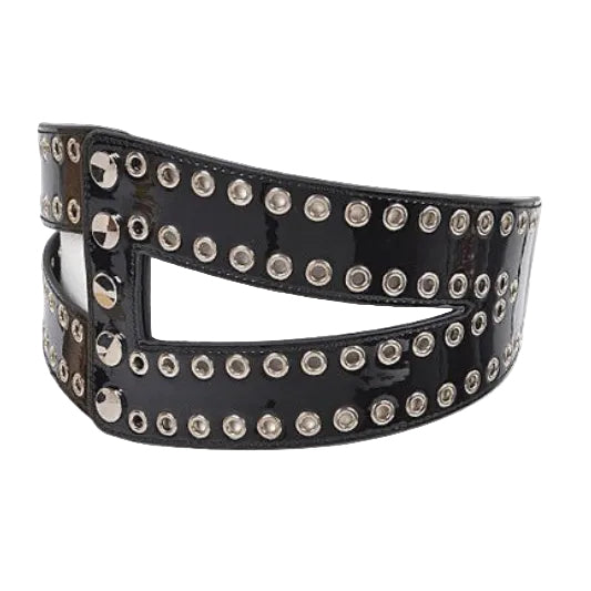 Black belt with silver studs on a mannequin against a white background